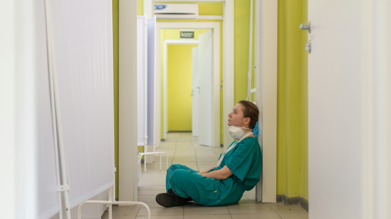 Nurse sitting on floor by Vladimir Fedotov